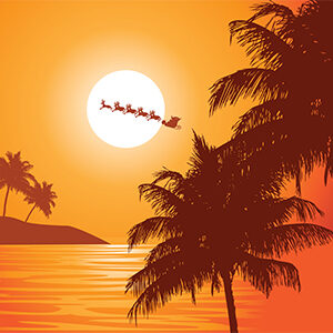 Palm trees and ocean at sunset with santa and reindeer flying the sleigh in the background