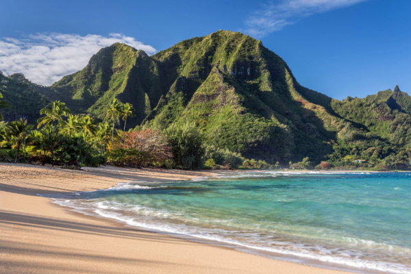 view of tunnels beach in kauai with mountains in the background
